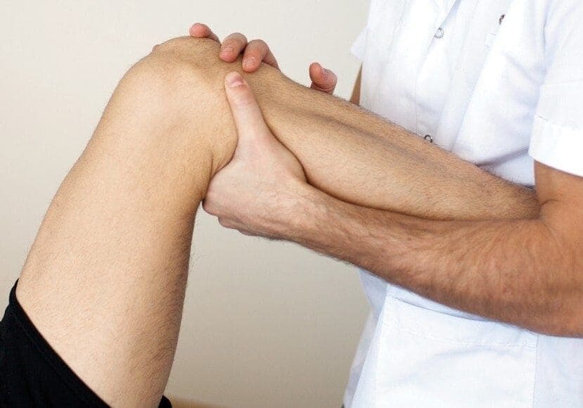 physical therapist applying myofascial therapy